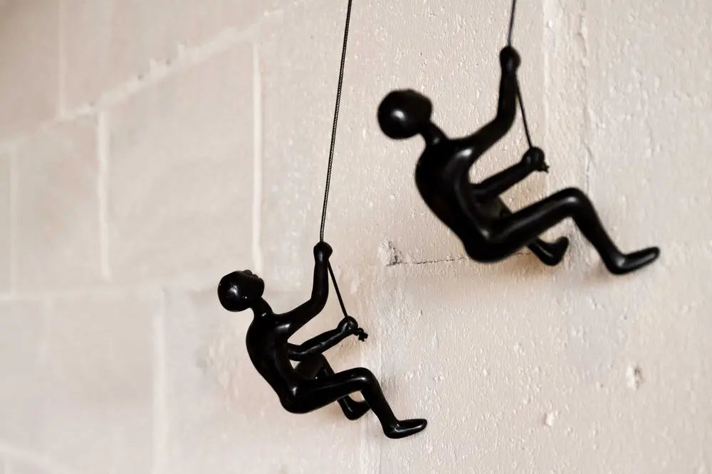 Set of Two Black Resin Climbing Man Hanging Dimensional Sculpture HomeRoots