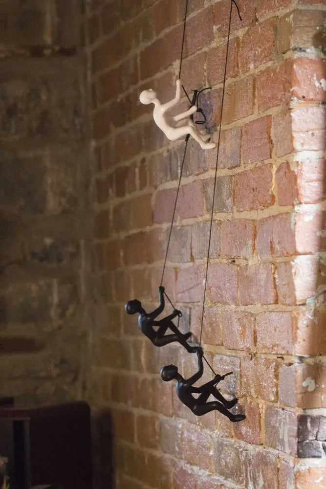Set of Two Black Resin Climbing Man Hanging Dimensional Sculpture HomeRoots