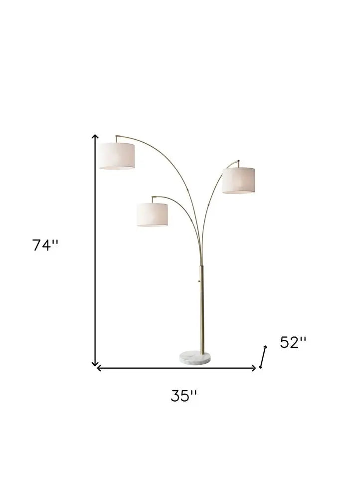 74" Brass Three Light Arc Floor Lamp With Off White Fabric Drum Shade HomeRoots