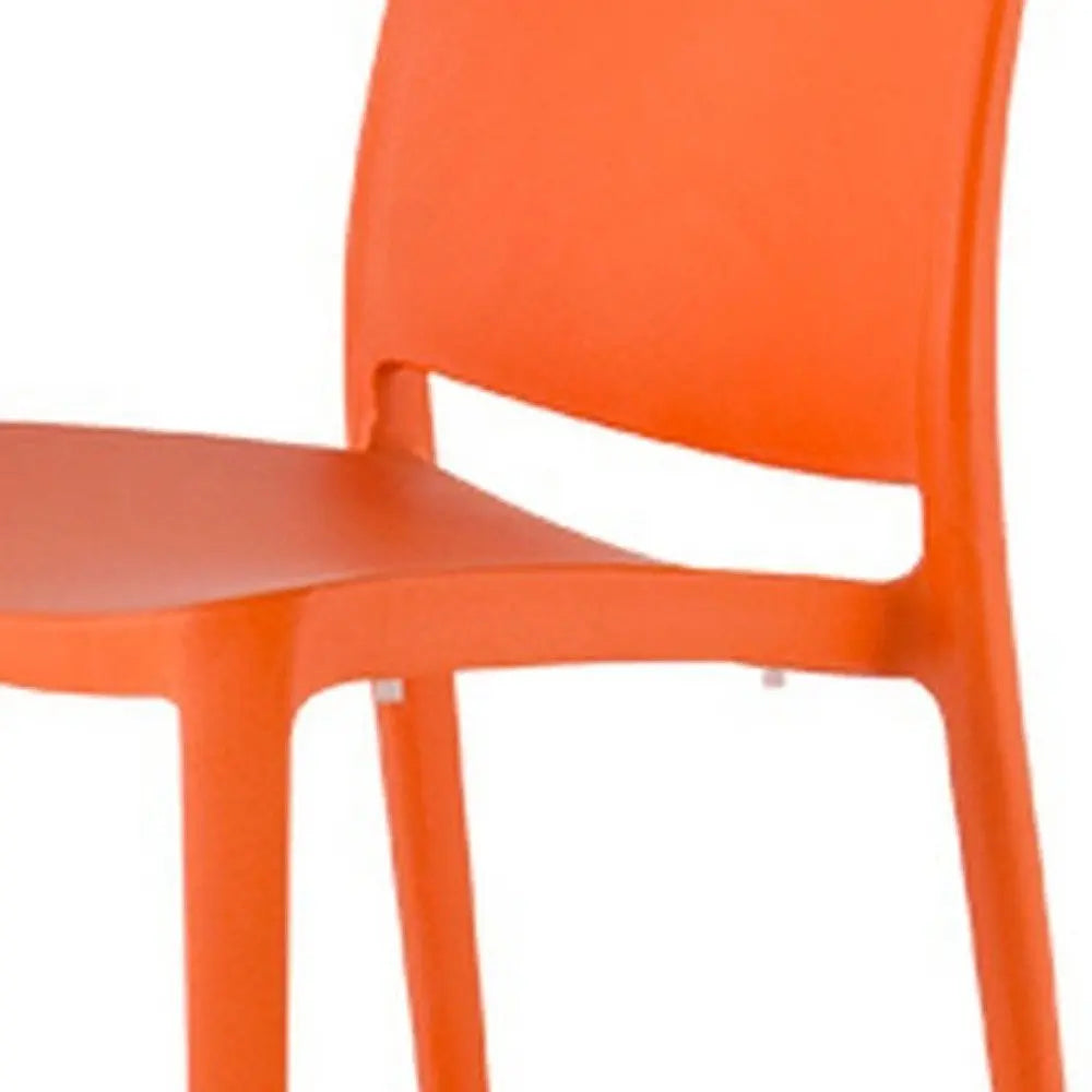 Set of Four Orange Heavy Duty Plastic Outdoor Stacking Dining Chairs - NOBLE HOME INTERIORS