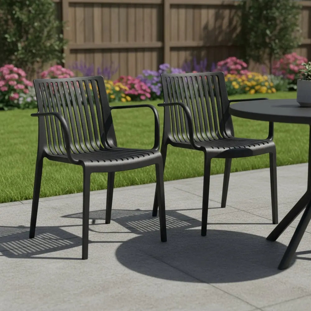 Set of Two Black Heavy Duty Plastic Outdoor Stacking Arm Chairs - NOBLE HOME INTERIORS