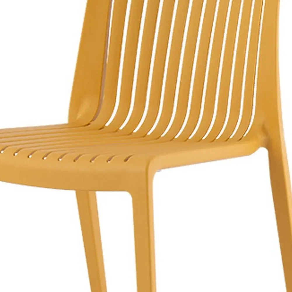 Set of Two Gold Heavy Duty Plastic Outdoor Stacking Accent Chairs - NOBLE HOME INTERIORS