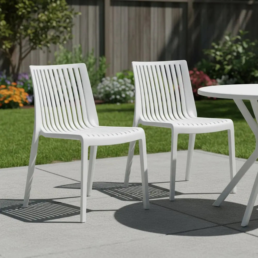 Set of Two White Heavy Duty Plastic Outdoor Stacking Accent Chairs - NOBLE HOME INTERIORS