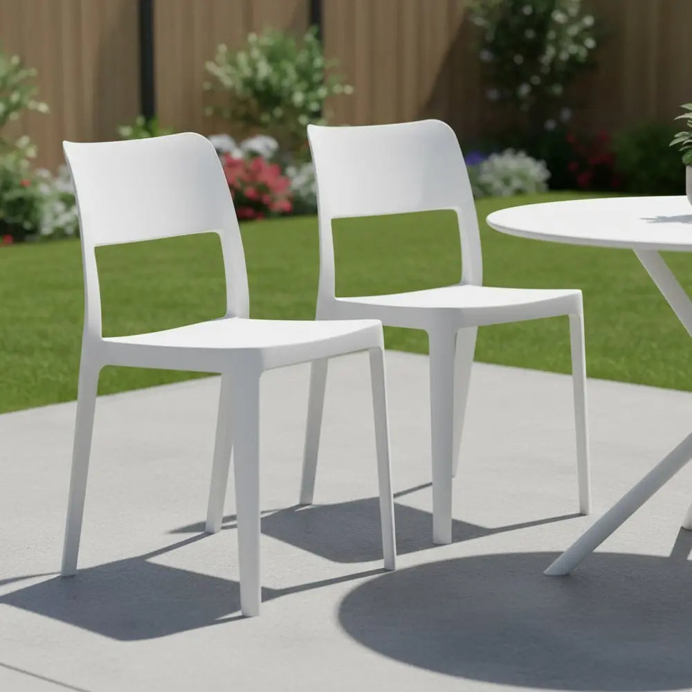 Set of Two White Heavy Duty Plastic Outdoor Stacking Accent Chairs - NOBLE HOME INTERIORS