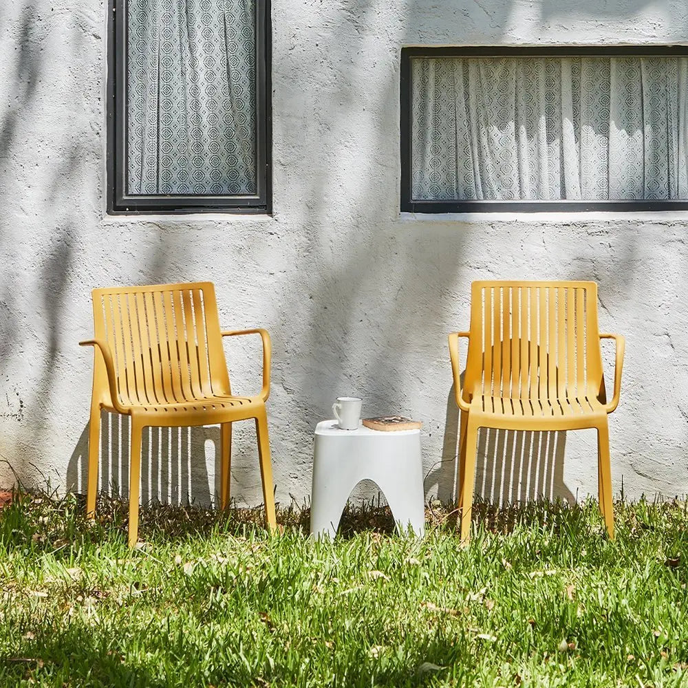 Set of Two Yellow Heavy Duty Plastic Outdoor Stacking Arm Chairs - NOBLE HOME INTERIORS